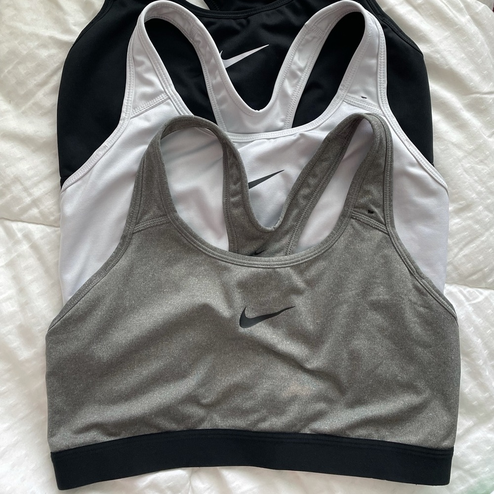 3 (grey, white, and black) NIKE sports bras